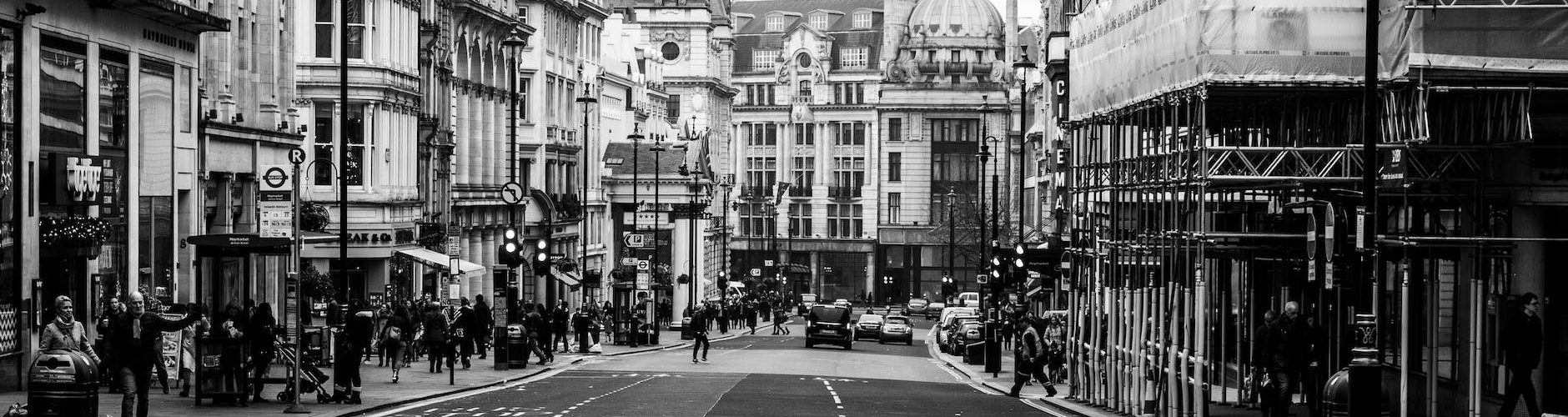 grayscale photo of street and buildings