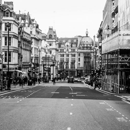 grayscale photo of street and buildings